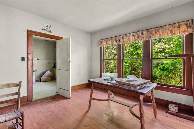 a reading room with furniture and a window