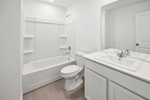 an empty room with windows and cabinet