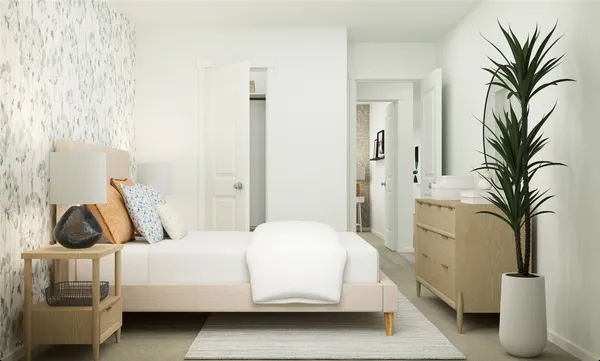 a bedroom with a bed and a couch