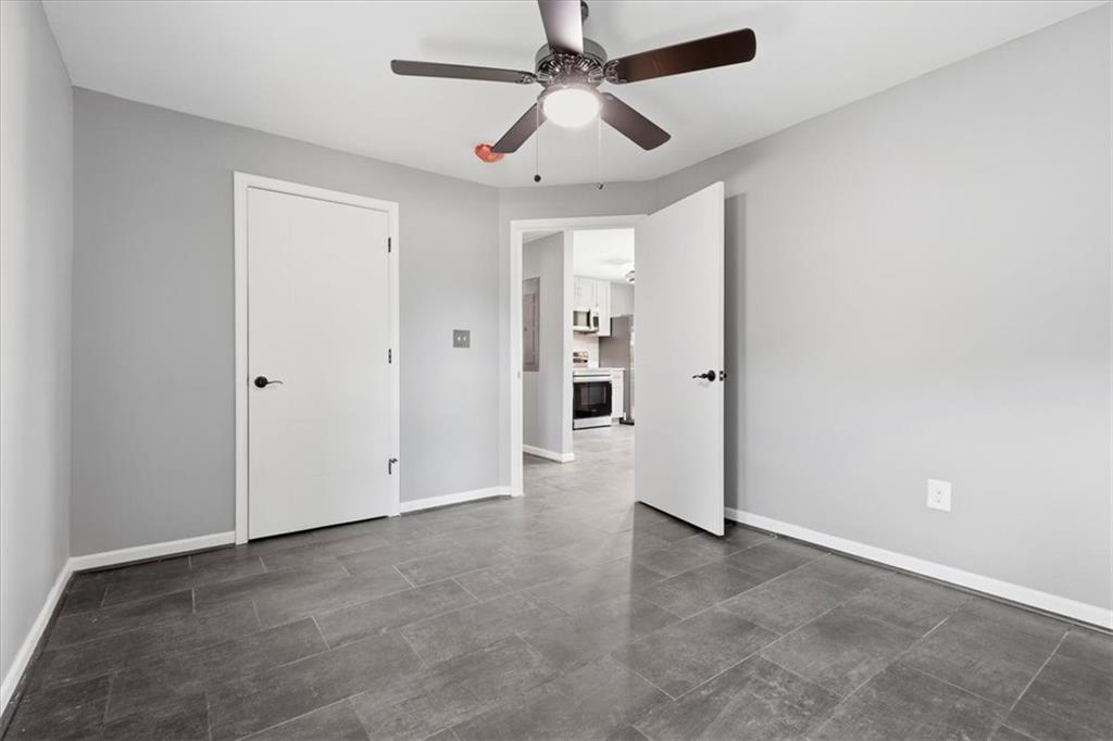 409 Calhoun Avenue Northeast Rome, GA 30161 - Photo 19 of 25 an empty room with closet and a ceiling fan