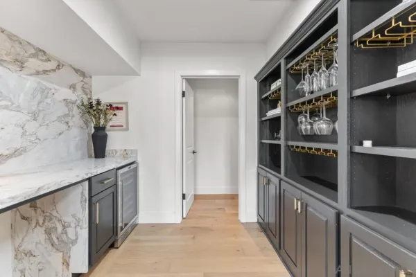 a bedroom with a bed and a night stand