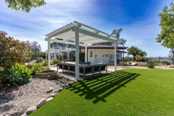 an aerial view of a house with a garden