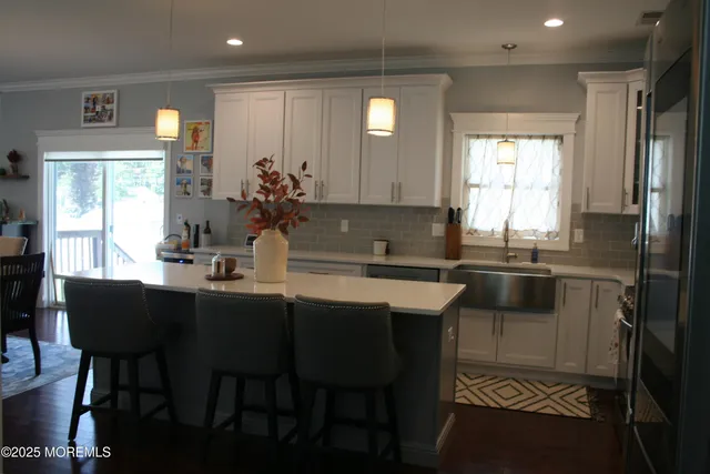 a kitchen with a sink cabinets and counter space
