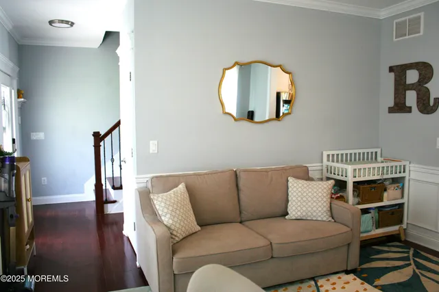 a living room with furniture fireplace and a flat screen tv