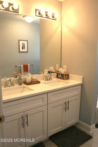 a bathroom with a glass shower door