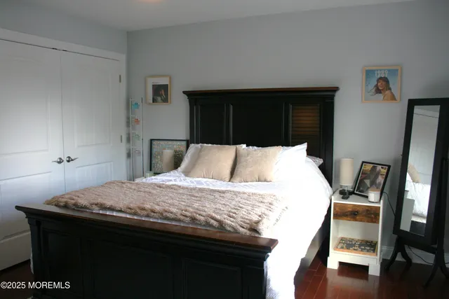 a living room with a bed and a table