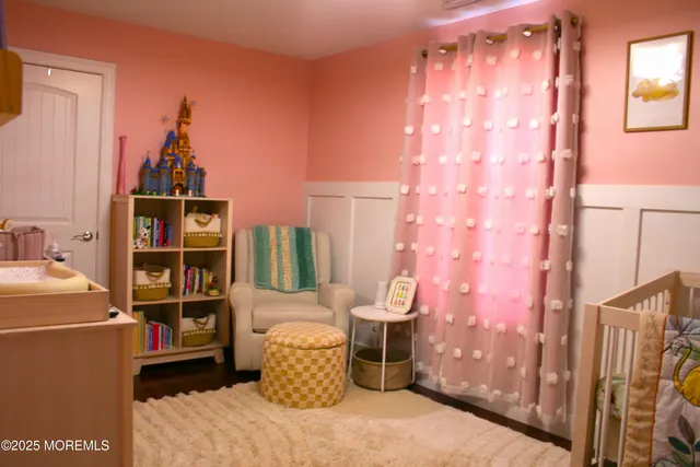 a bathroom with a sink a toilet and a shower curtain