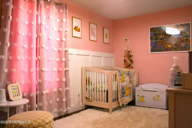 a room with furniture a flat screen tv and a floor to ceiling window