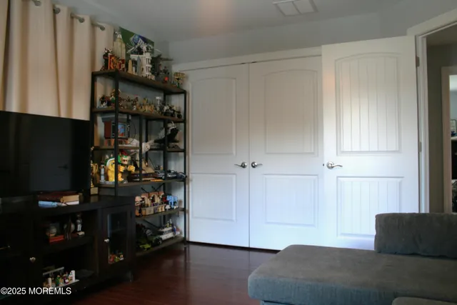 a white toilet sitting next to a bath tub