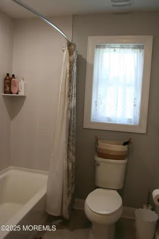 a room with furniture and a flat screen tv