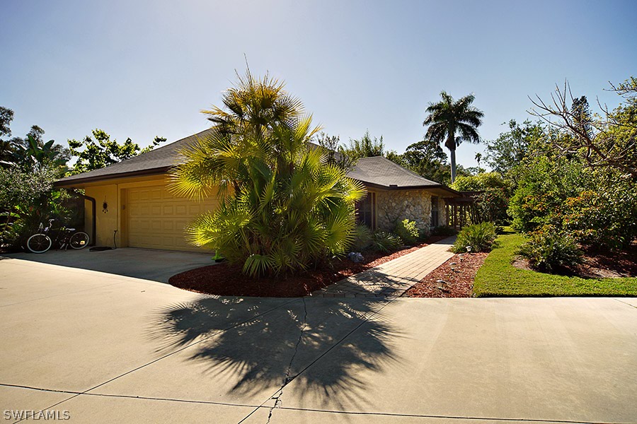 944 Robalo Drive Fort Myers, FL 33919 - Photo 12 of 14 a view of a yard with plants