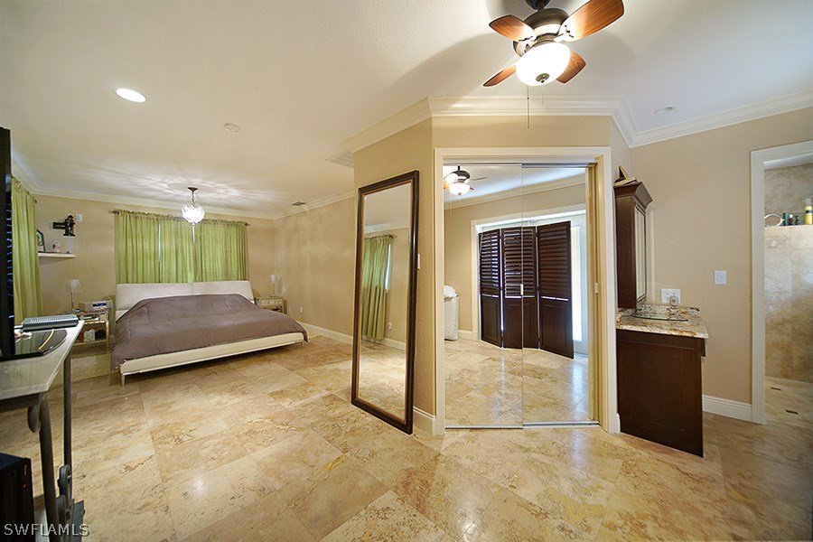 944 Robalo Drive Fort Myers, FL 33919 - Photo 6 of 14 a view of a livingroom with furniture and a flat screen tv