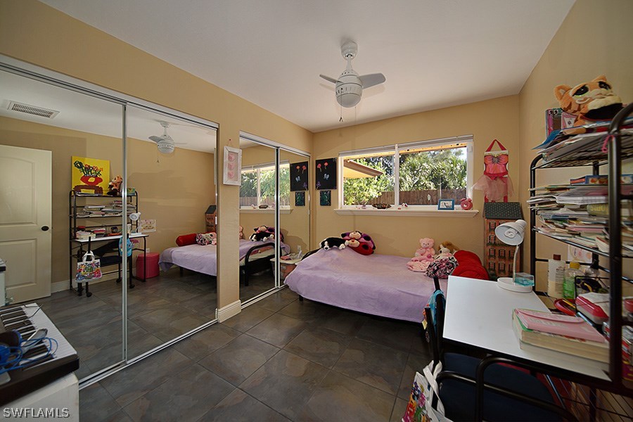 944 Robalo Drive Fort Myers, FL 33919 - Photo 10 of 14 a living room with furniture and a window