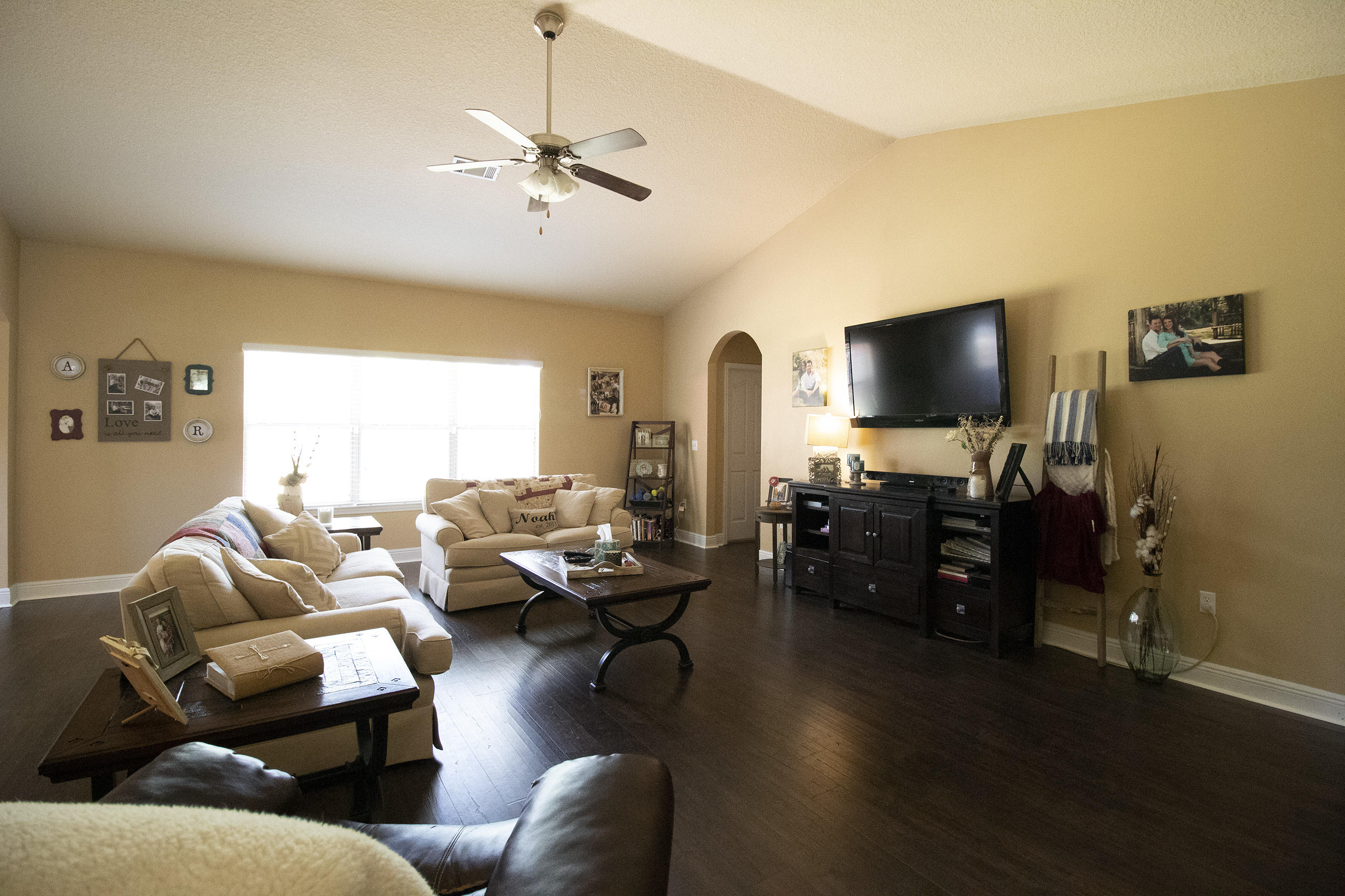 206 Mango Lane Freeport, FL 32439 - Photo 11 of 45 a living room with furniture and a flat screen tv