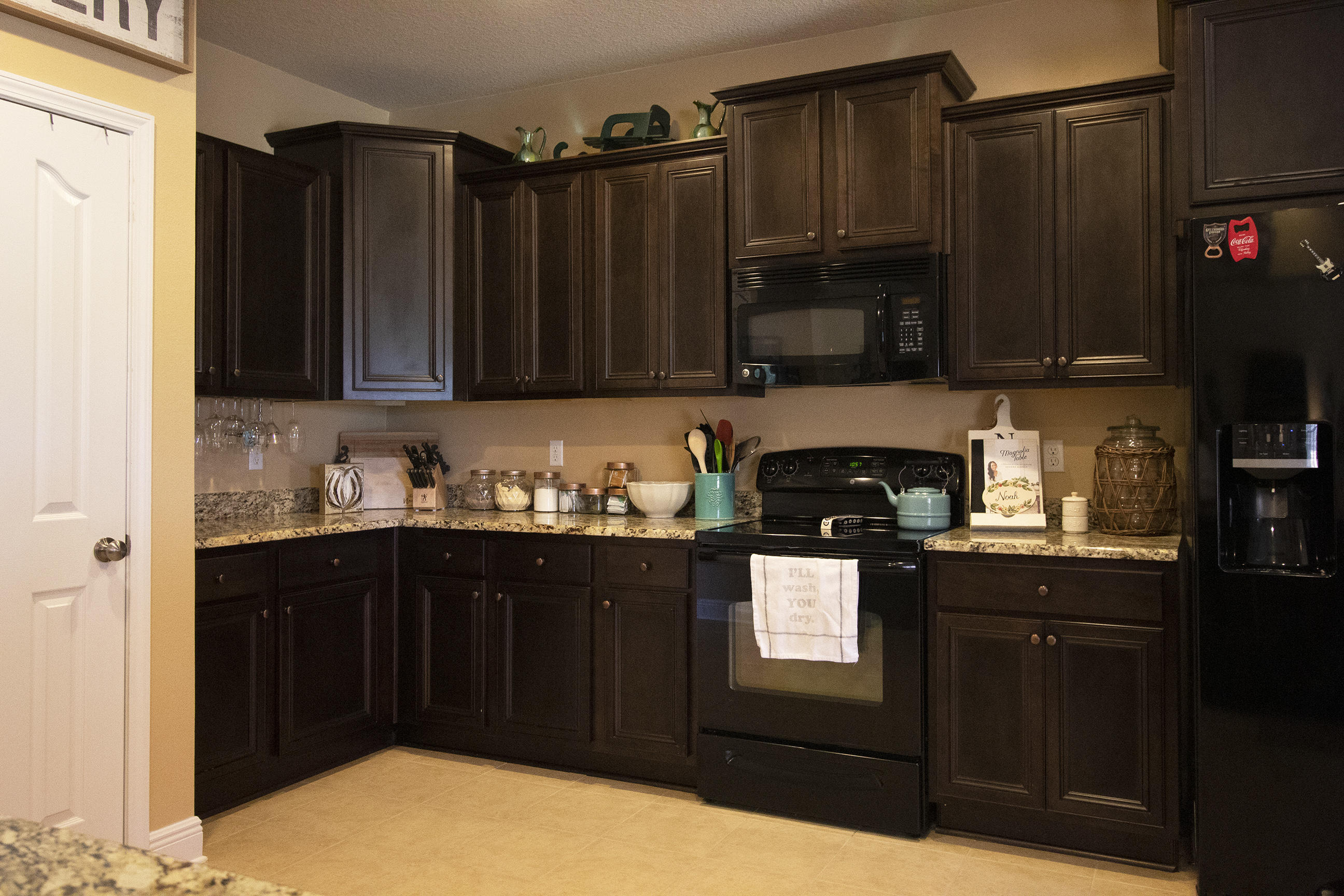 206 Mango Lane Freeport, FL 32439 - Photo 19 of 45 a kitchen with granite countertop a refrigerator and a stove