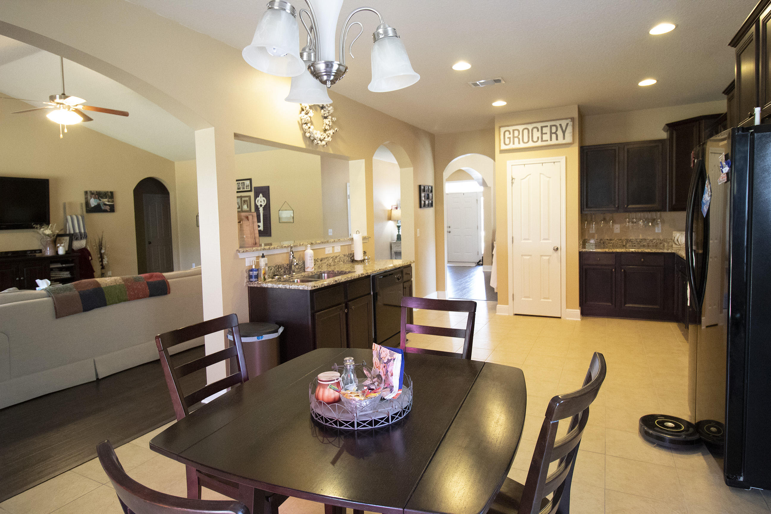 206 Mango Lane Freeport, FL 32439 - Photo 22 of 45 a living room with stainless steel appliances furniture a fireplace and a view