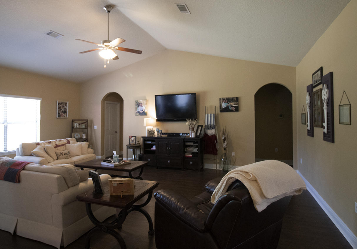 206 Mango Lane Freeport, FL 32439 - Photo 26 of 45 a living room with furniture and a flat screen tv