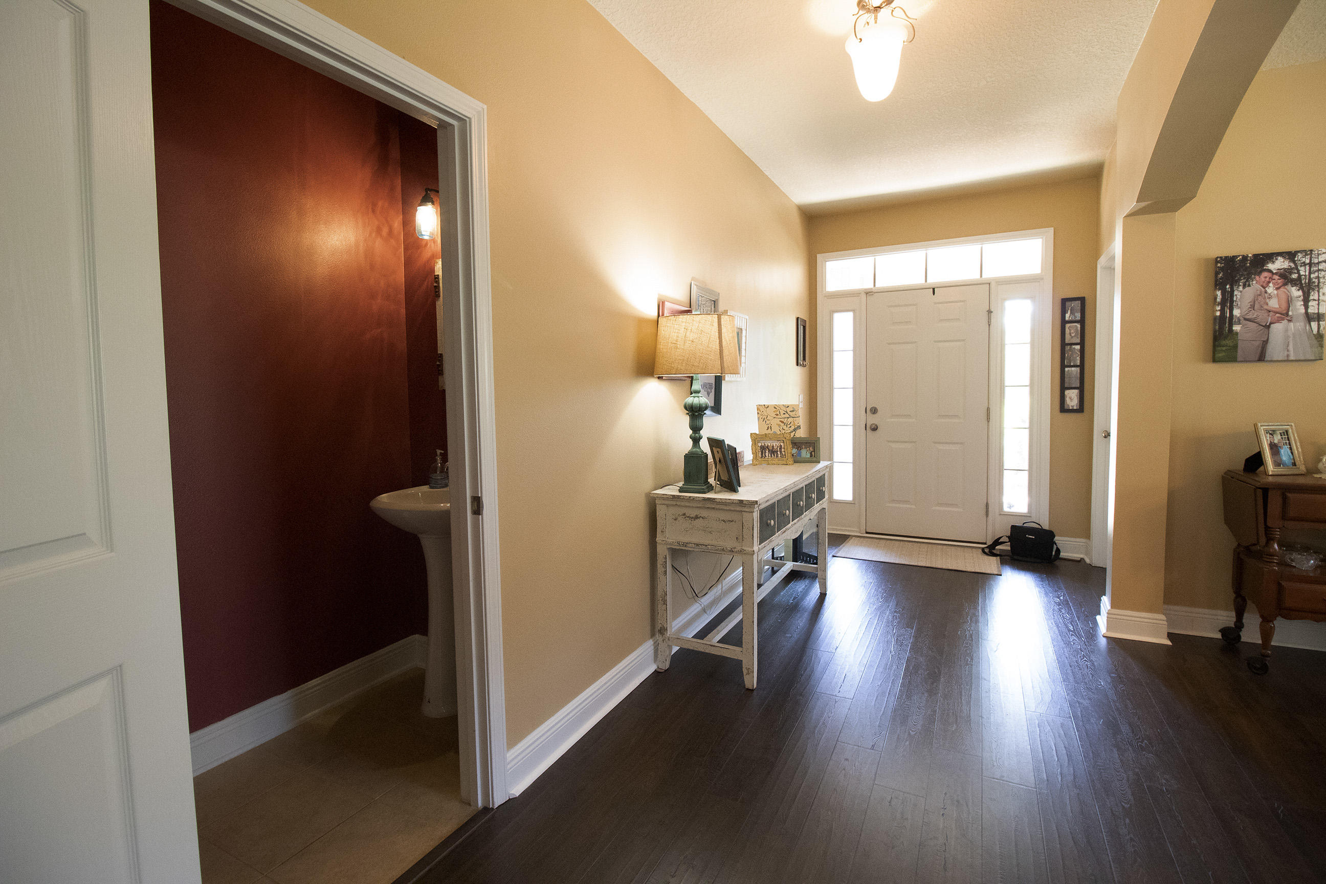 206 Mango Lane Freeport, FL 32439 - Photo 36 of 45 an empty room with wooden floor and windows