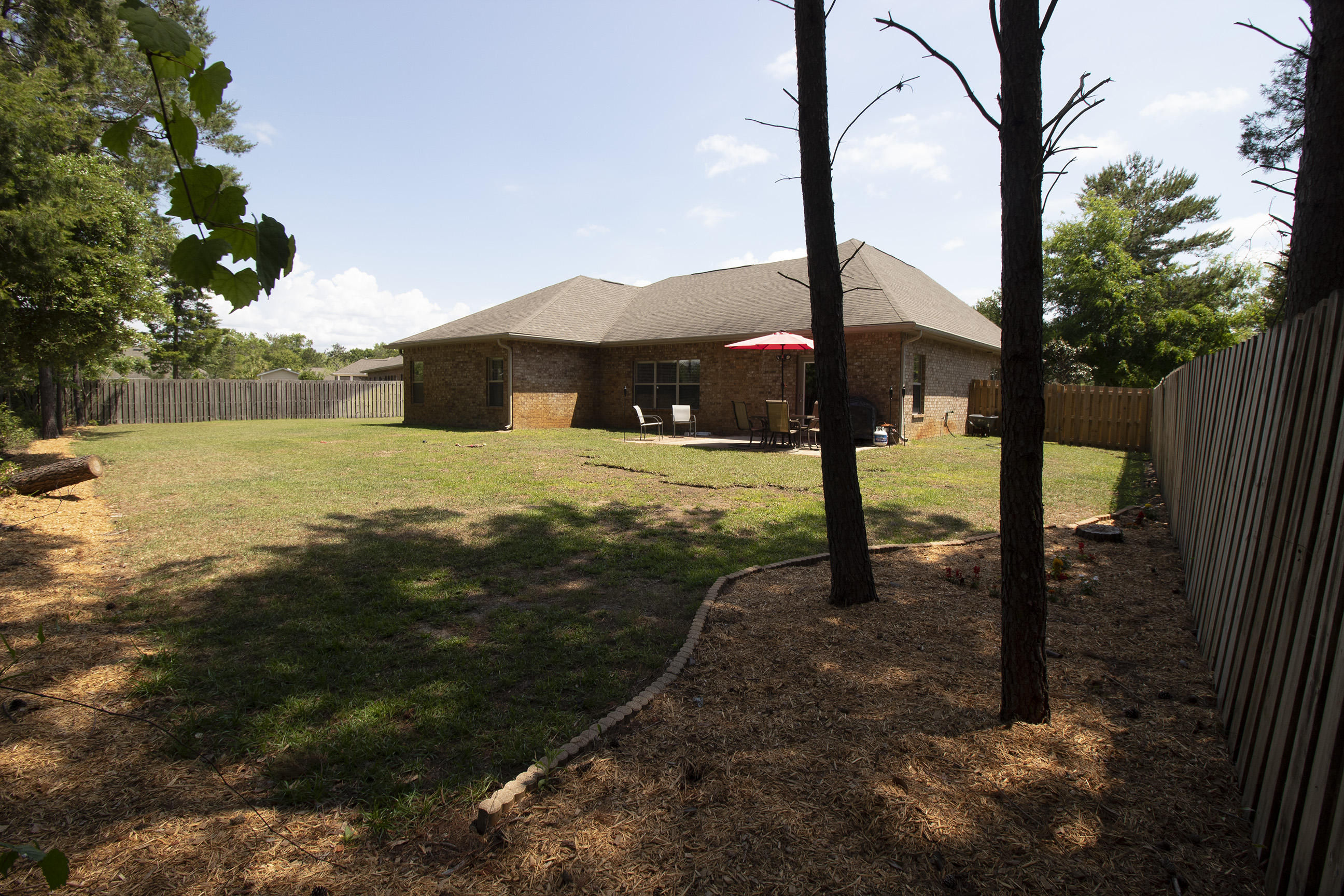 206 Mango Lane Freeport, FL 32439 - Photo 39 of 45 a view of a street with an outdoor space