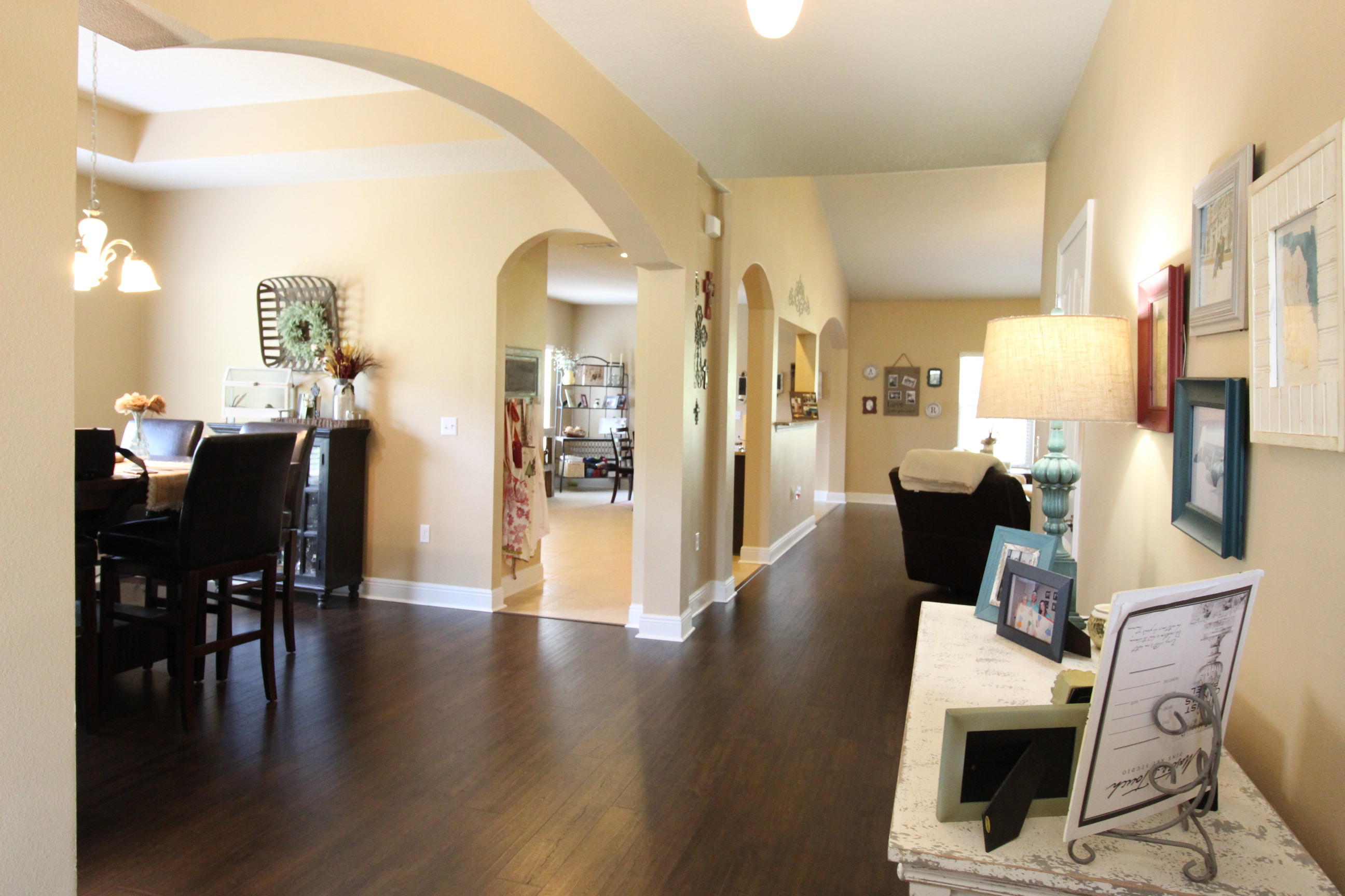 206 Mango Lane Freeport, FL 32439 - Photo 5 of 45 a view of a dining room with furniture and wooden floor