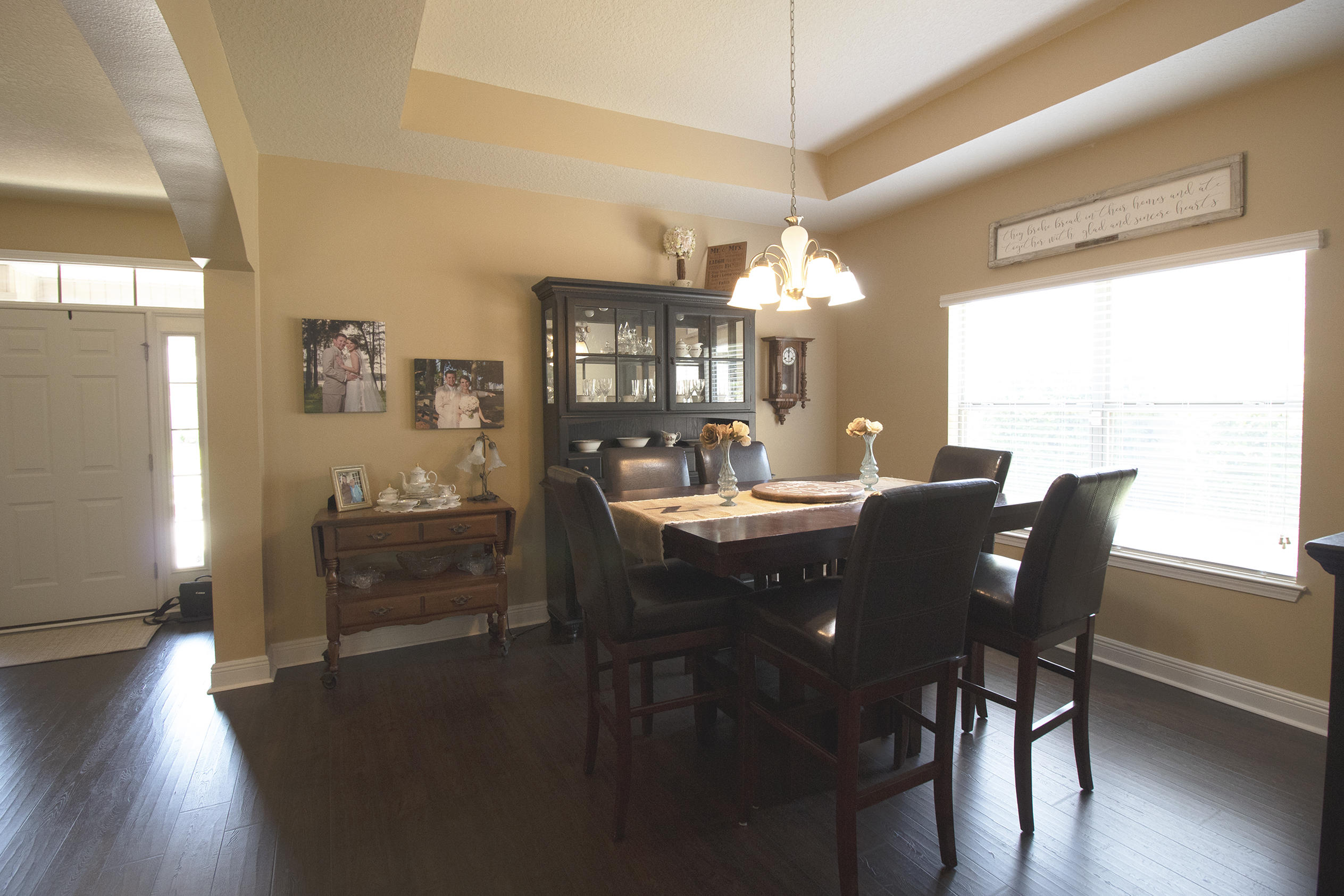 206 Mango Lane Freeport, FL 32439 - Photo 7 of 45 a dining room with furniture a chandelier and wooden floor