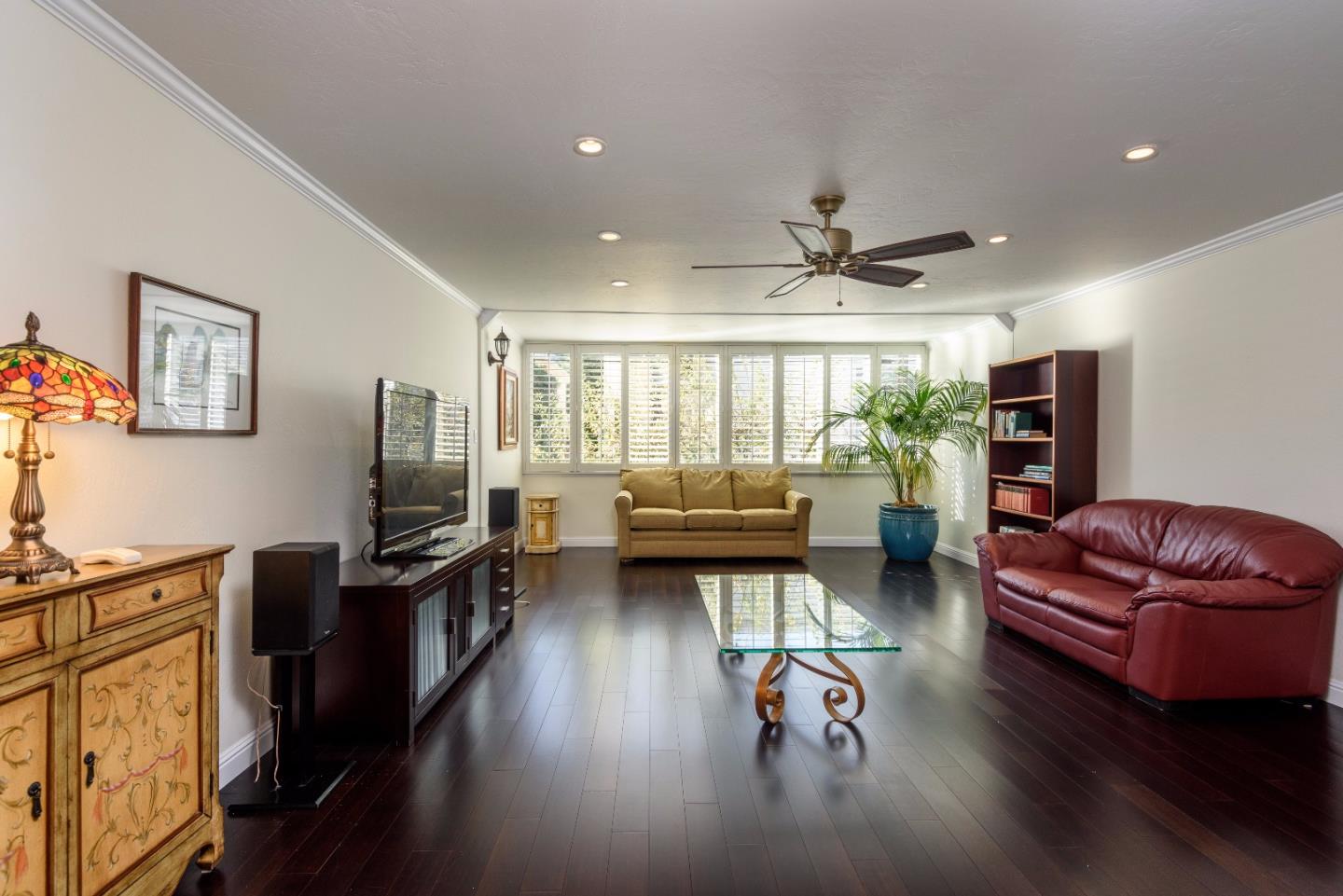 200 Elm Street, Unit 107 San Mateo, CA 94401 - Photo 2 of 11 a living room with furniture floor to ceiling window and a flat screen tv