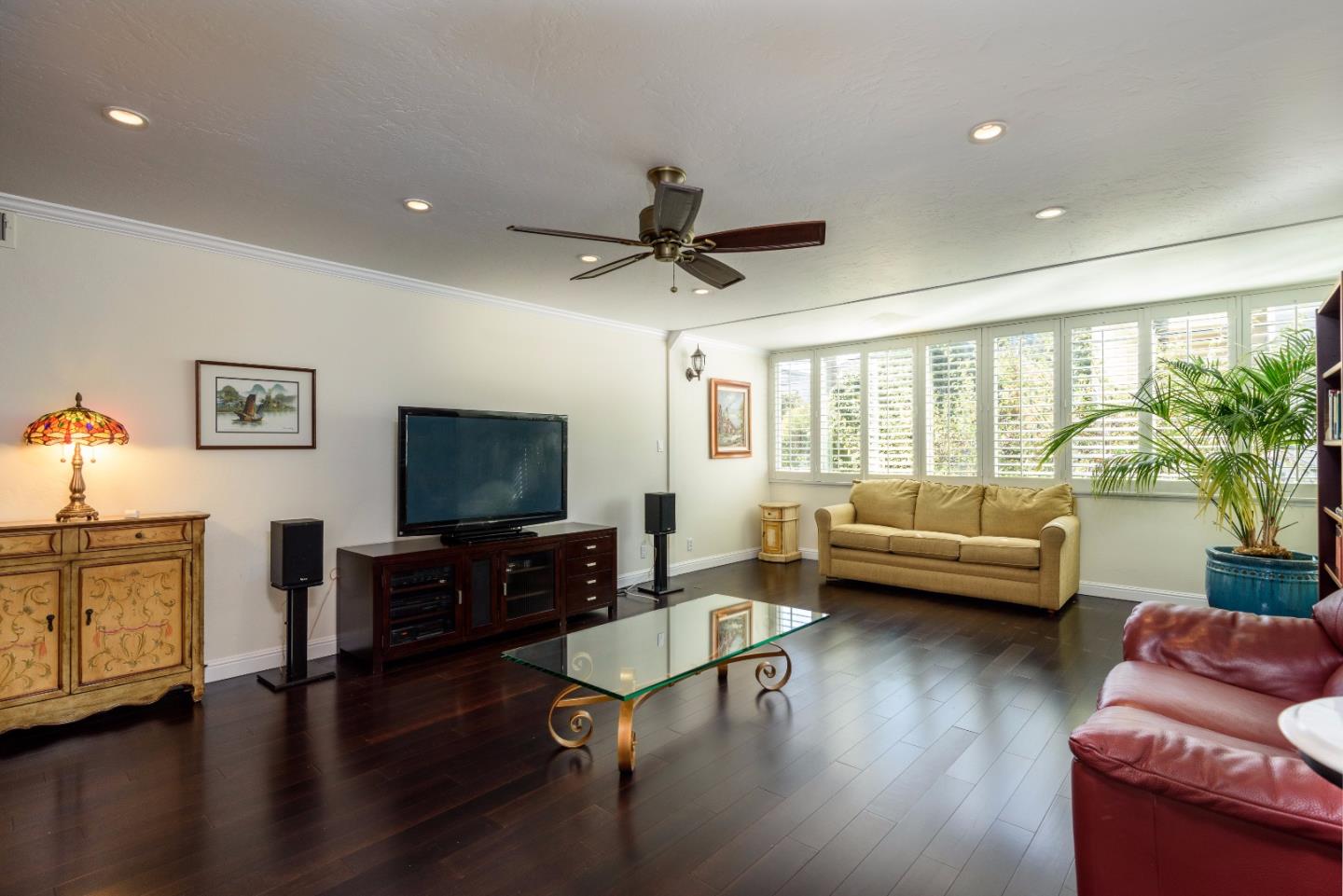 200 Elm Street, Unit 107 San Mateo, CA 94401 - Photo 3 of 11 a living room with furniture and a flat screen tv with wooden floor