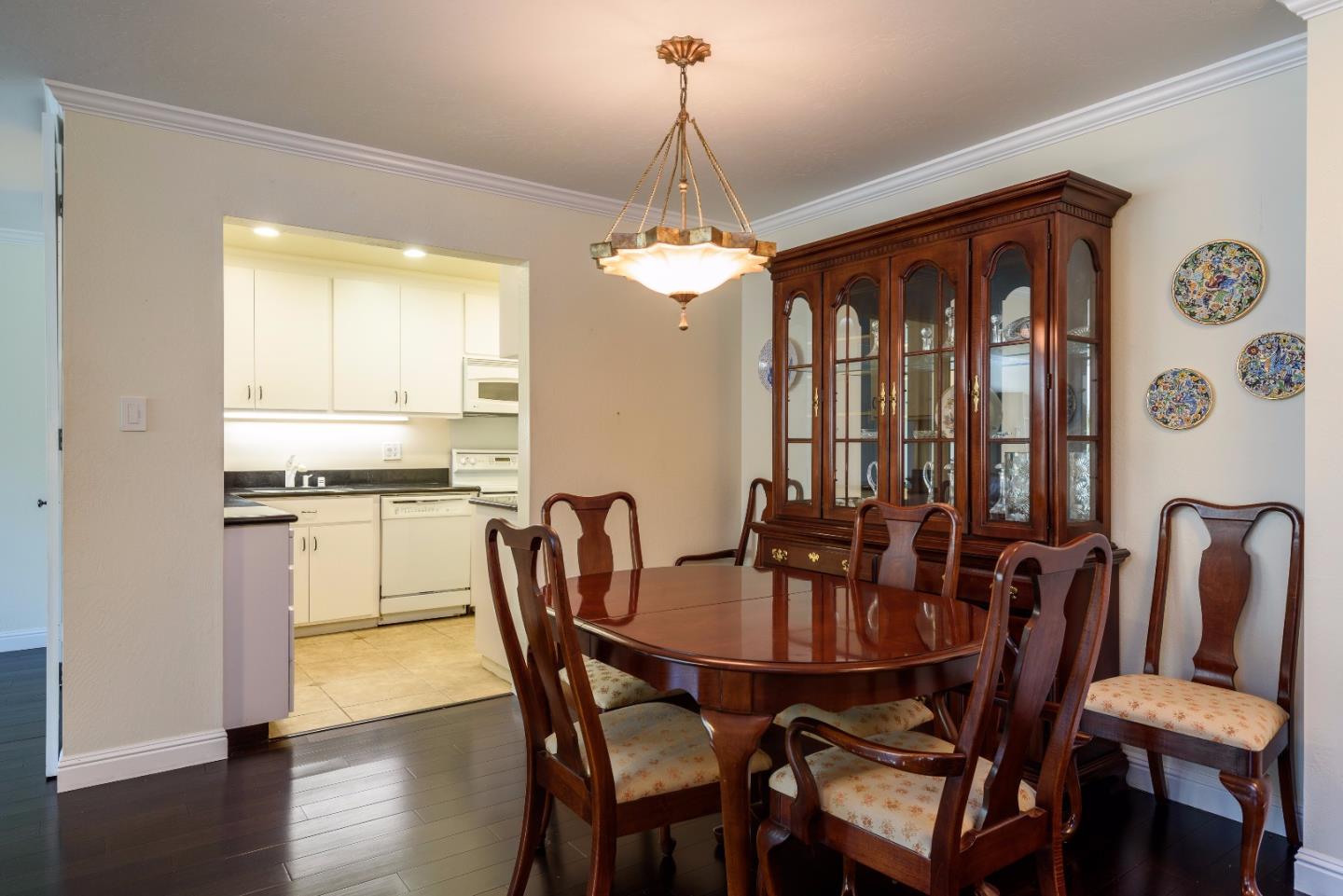 200 Elm Street, Unit 107 San Mateo, CA 94401 - Photo 4 of 11 a view of a dining room with furniture window and wooden floor