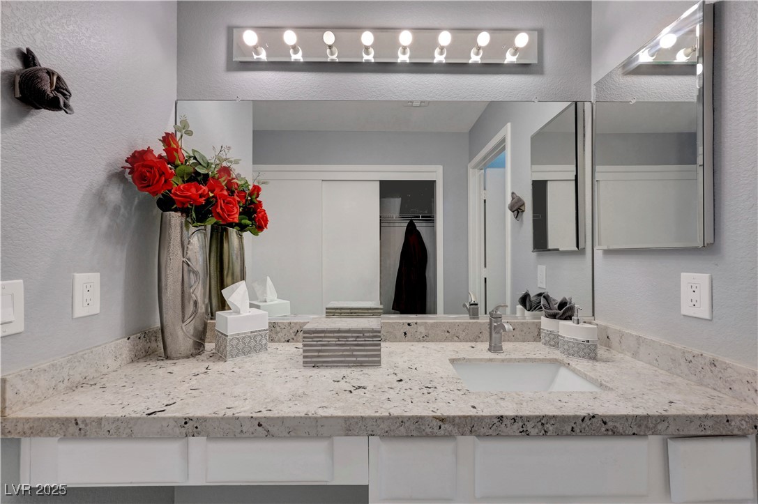 Undisclosed Address Las Vegas, NV 89134 - Photo 16 of 39 Bathroom with a textured wall and vanity
