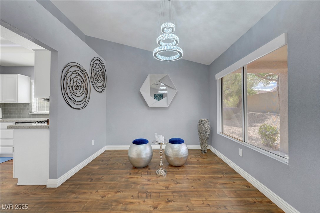 Undisclosed Address Las Vegas, NV 89134 - Photo 22 of 39 Dining area with dark wood finished floors, plenty of natural light, and a chandelier