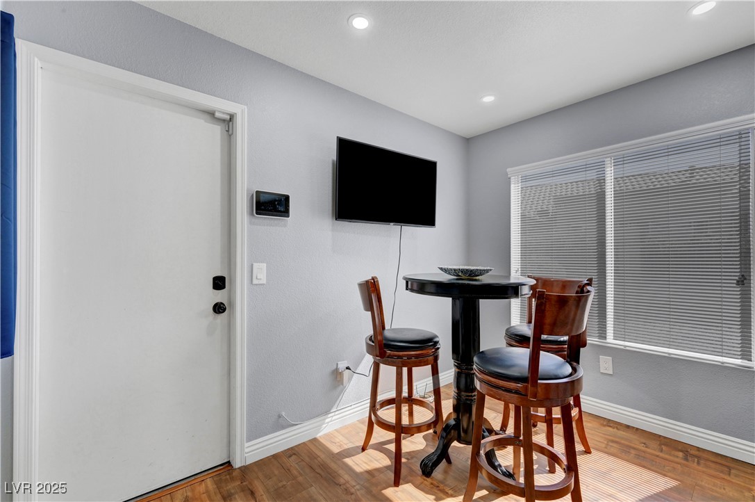 Undisclosed Address Las Vegas, NV 89134 - Photo 23 of 39 Dining space with light wood-style flooring, a textured wall, and recessed lighting