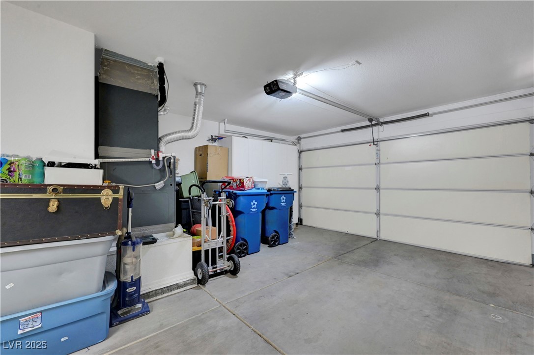 Undisclosed Address Las Vegas, NV 89134 - Photo 27 of 39 Garage featuring a garage door opener