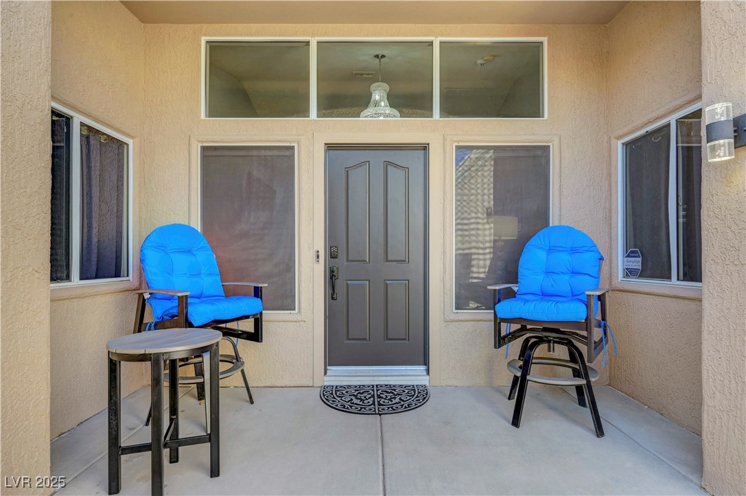 Undisclosed Address Las Vegas, NV 89134 - Photo 29 of 39 View of exterior entry with a patio and stucco siding