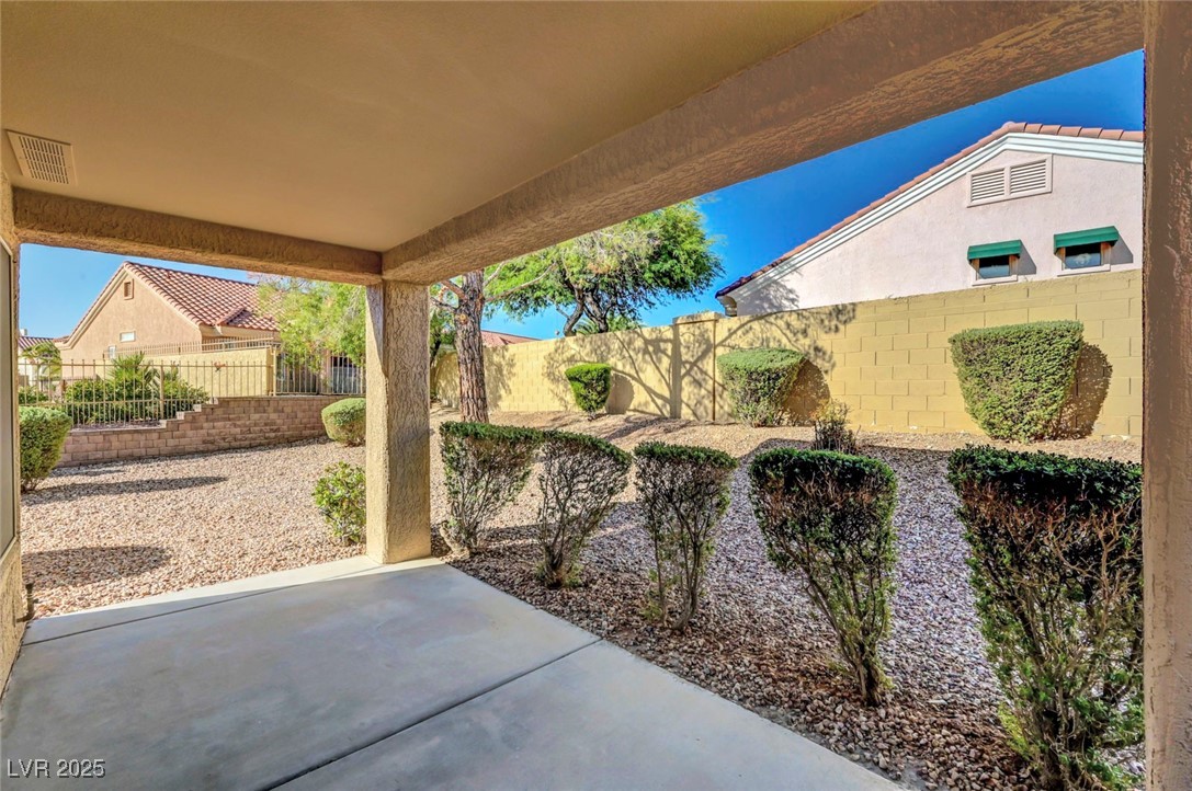 Undisclosed Address Las Vegas, NV 89134 - Photo 38 of 39 Fenced backyard with a patio area