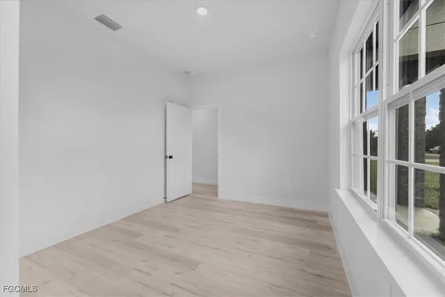 a view of an empty room with a window