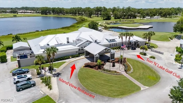 an aerial view of a house with outdoor space and a lake view