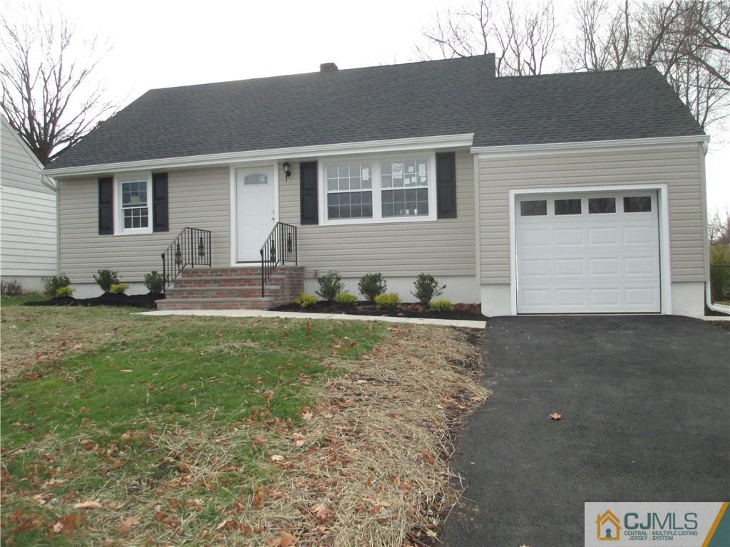 77 Middle Hill Road Colonia, NJ 07067 - Photo 1 of 21 a front view of a house with garden