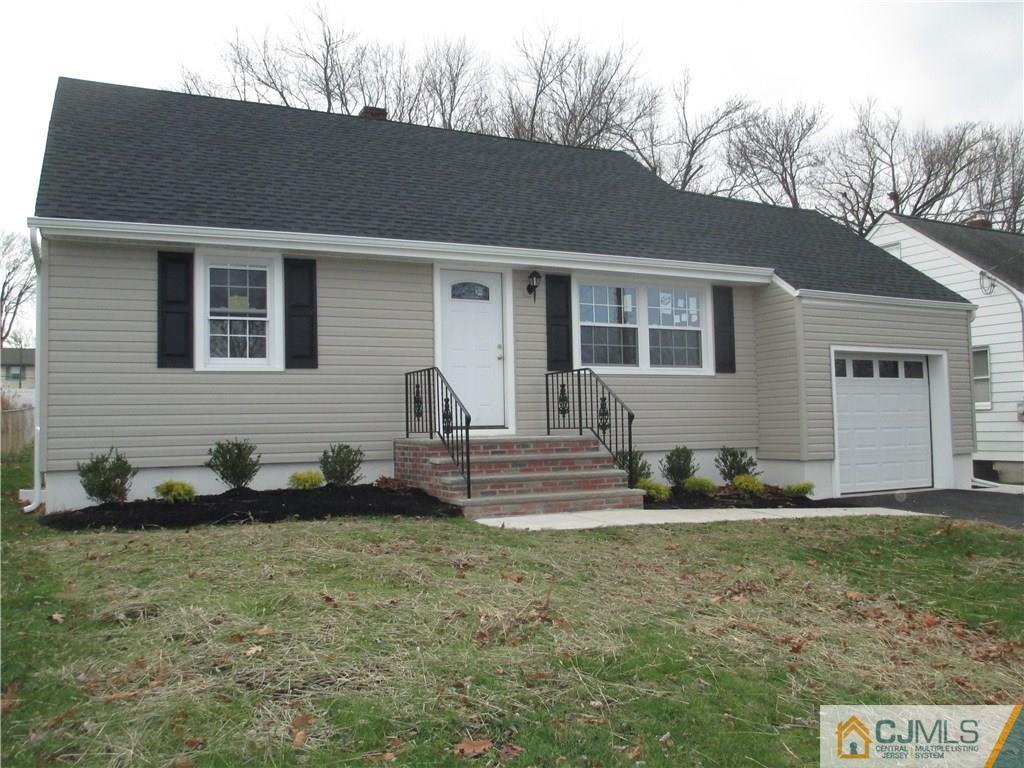 77 Middle Hill Road Colonia, NJ 07067 - Photo 2 of 21 a front view of house with yard