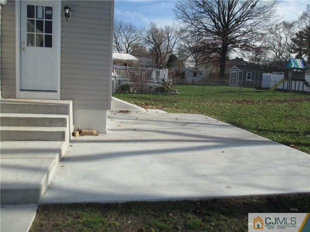 77 Middle Hill Road Colonia, NJ 07067 - Photo 13 of 21 a view of a yard and front door