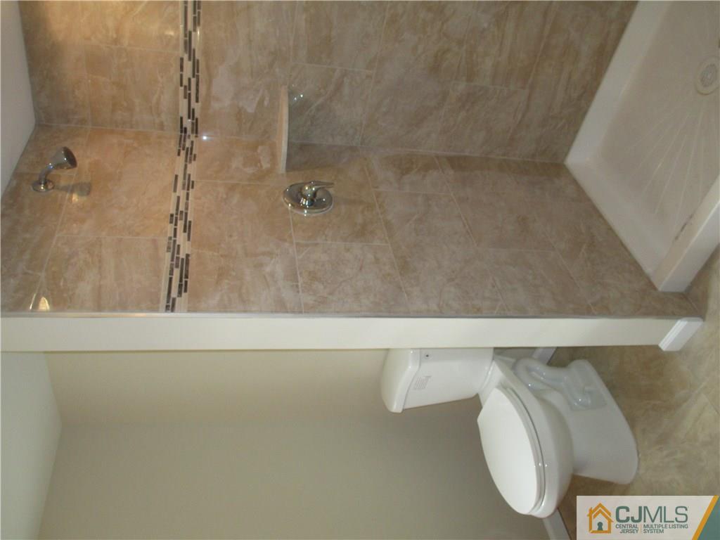 77 Middle Hill Road Colonia, NJ 07067 - Photo 15 of 21 a bathroom with a bathtub and shower