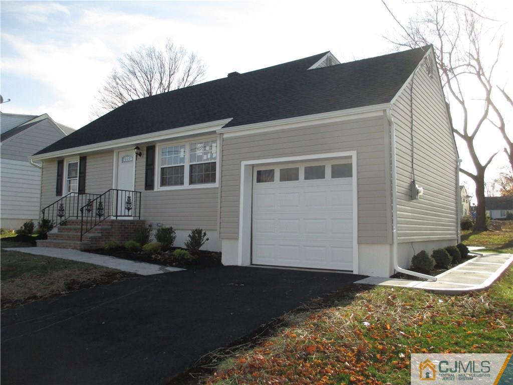 77 Middle Hill Road Colonia, NJ 07067 - Photo 21 of 21 a front view of a house with yard