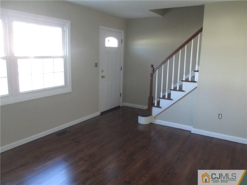 77 Middle Hill Road Colonia, NJ 07067 - Photo 7 of 21 a view of entryway with wooden floor