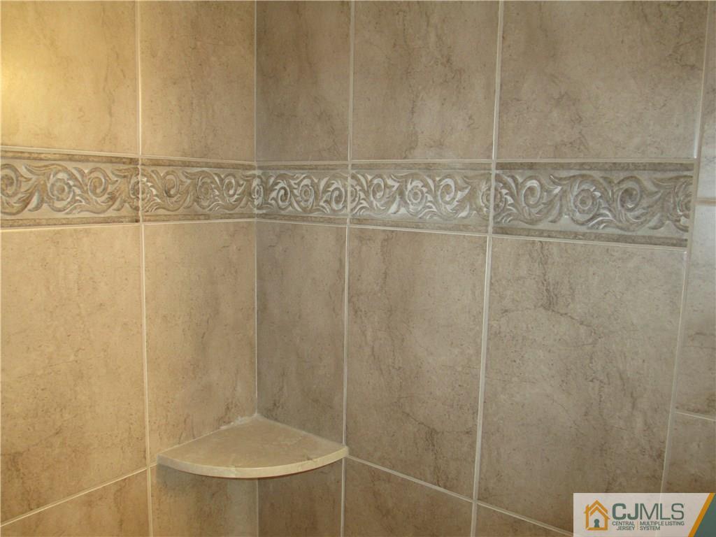 77 Middle Hill Road Colonia, NJ 07067 - Photo 9 of 21 a bathroom with a shower