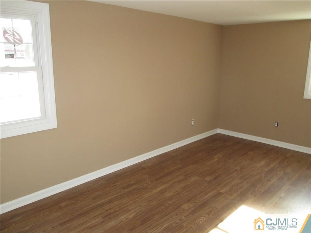 77 Middle Hill Road Colonia, NJ 07067 - Photo 10 of 21 a view of a small space with wooden floor and a window