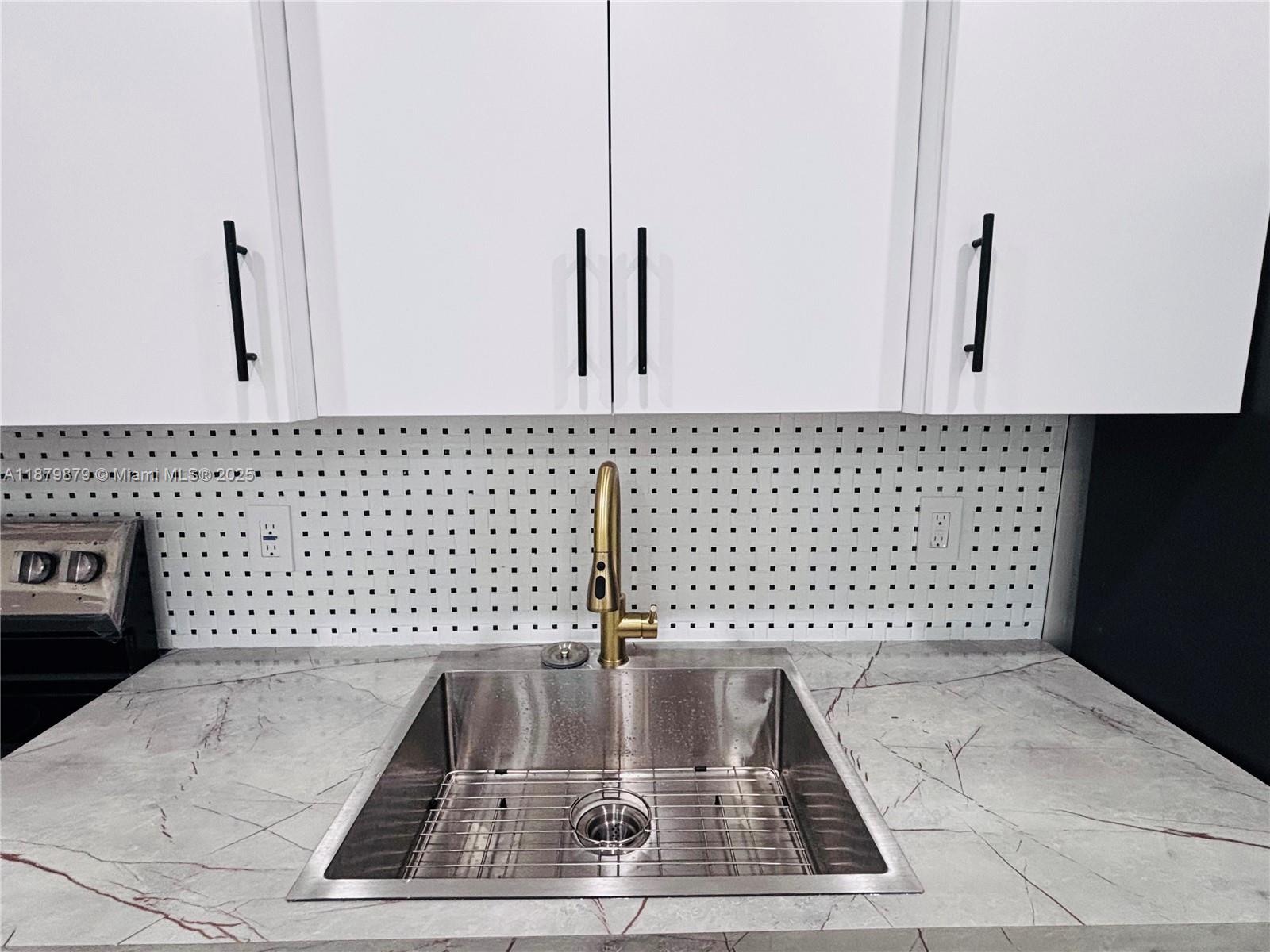 220 Northwest 27th Avenue, Unit 14 Pompano Beach, FL 33069 - Photo 2 of 8 a view of a bathroom with a shower