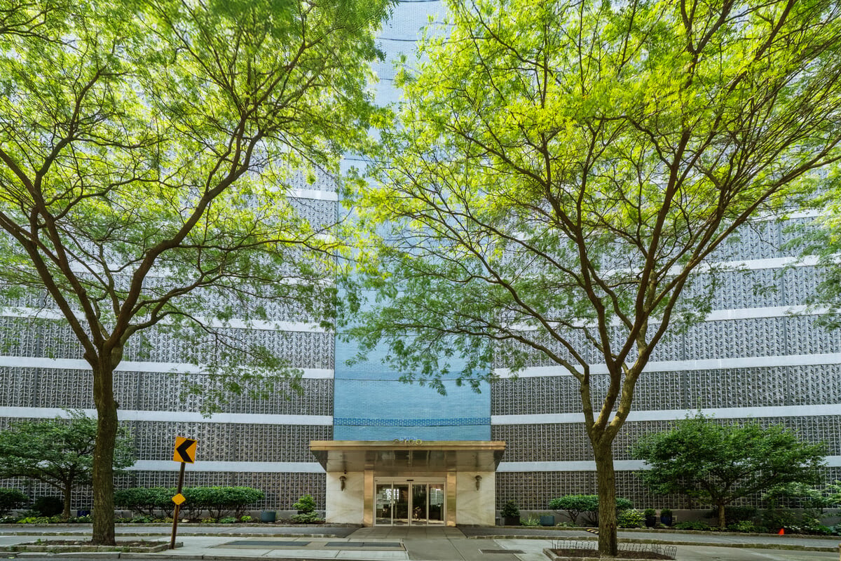 an outdoor view of house with green space