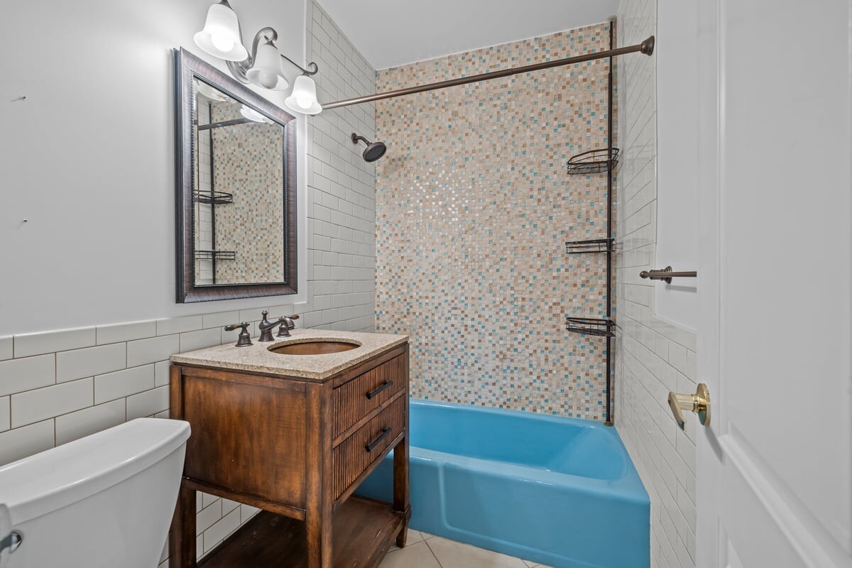 2400 Johnson Avenue, Unit 2F Bronx, NY 10463 - Photo 16 of 25 a bathroom with a sink a toilet and shower