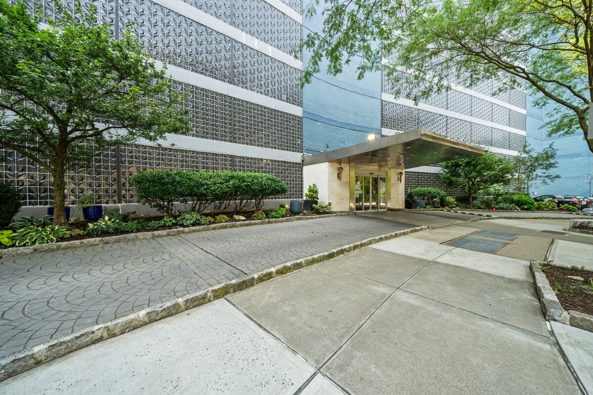 2400 Johnson Avenue, Unit 2F Bronx, NY 10463 - Photo 24 of 25 a view of a house with a yard and large tree