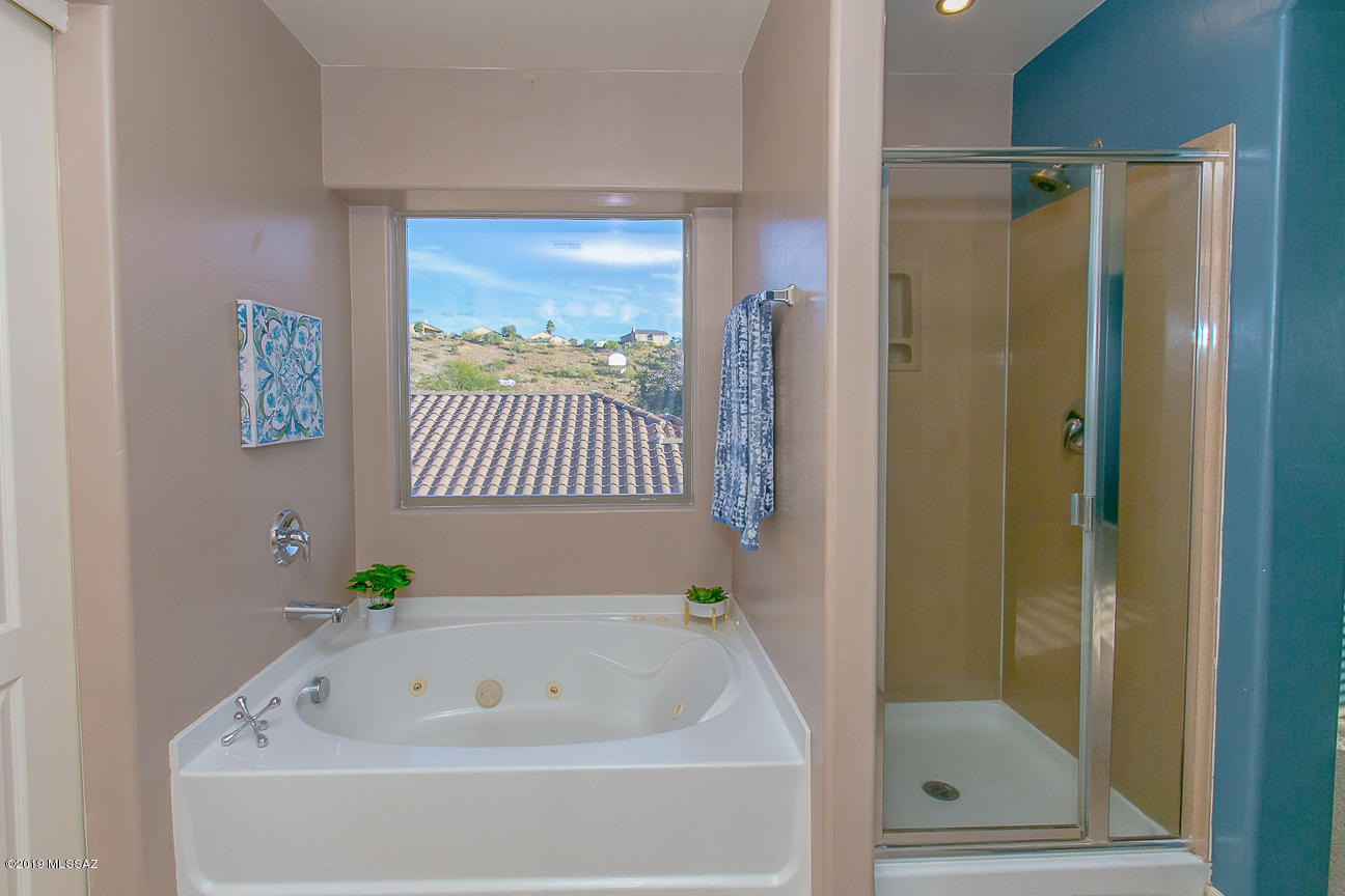 39103 Winners Circle Tucson, AZ 85739 - Photo 8 of 19 a bathroom with a bathtub and shower
