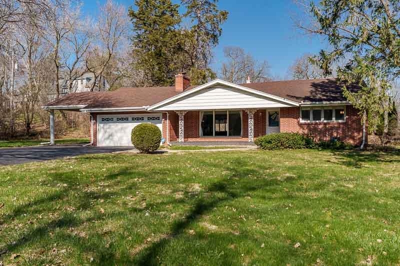 2309 Harris Road Rockford, IL 61107 - Photo 1 of 42 a front view of a house with garden